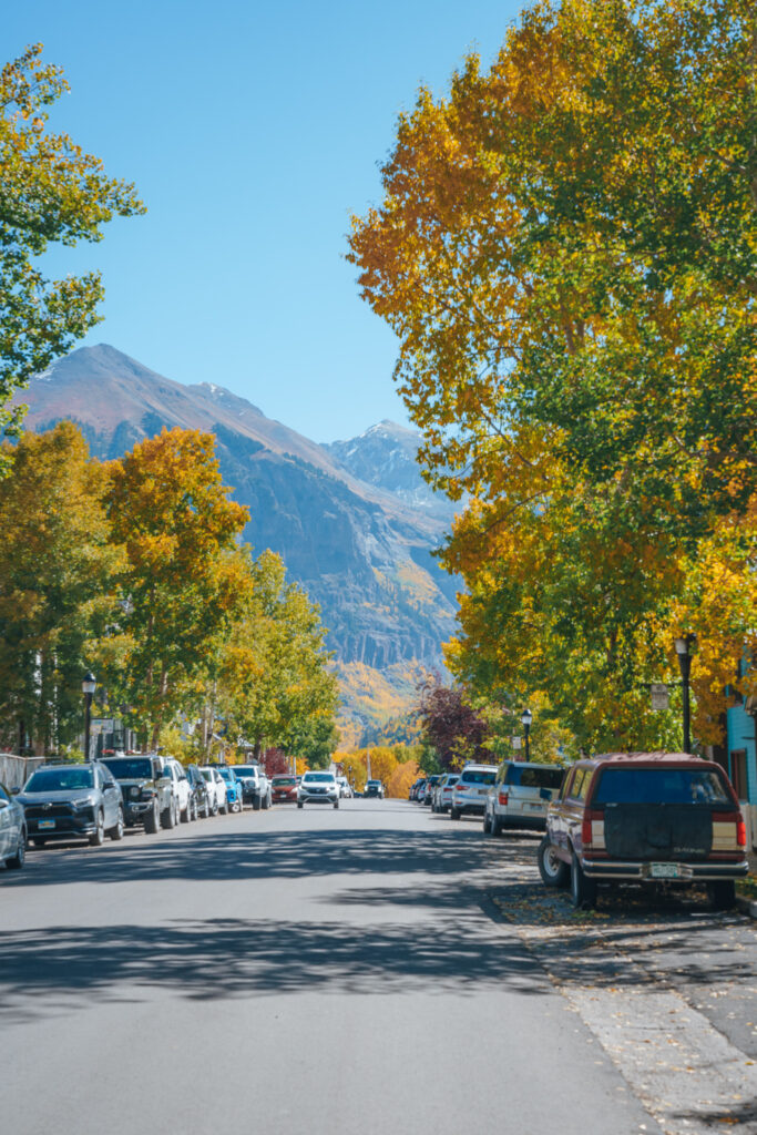 Fall foliage with view of mountain on a street in Telluride town