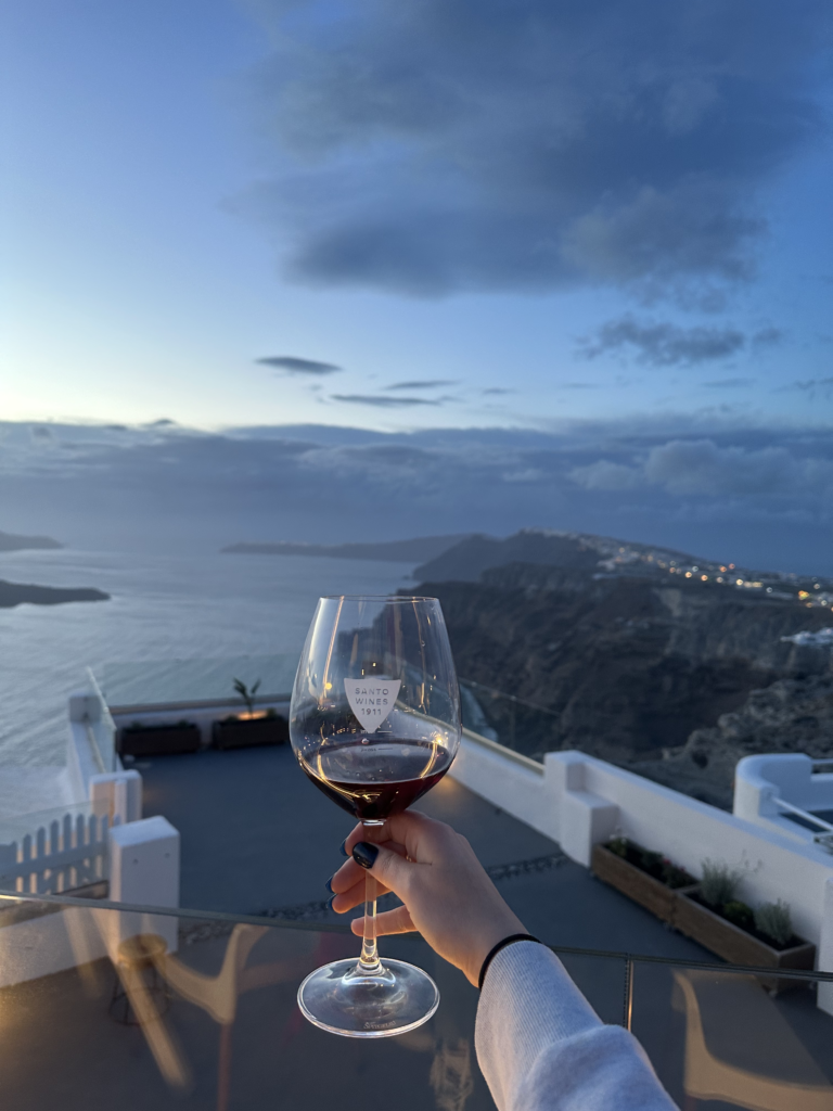 Wine and sunset view in Santorini